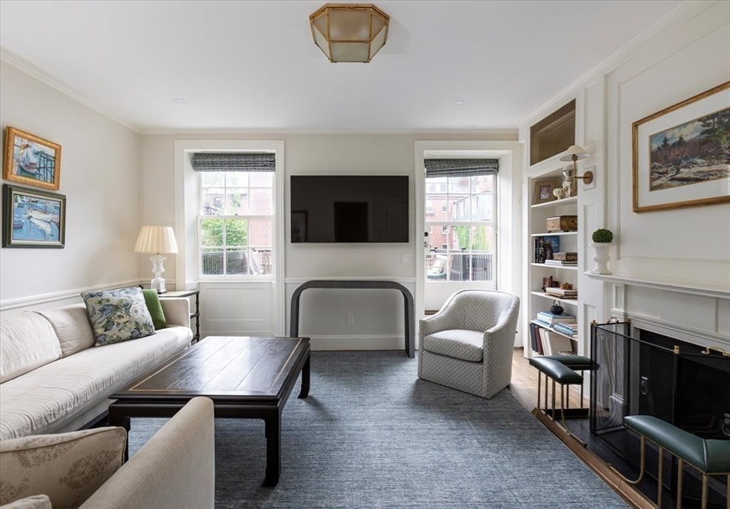 62 Chestnut Street Boston, MA 02108 - Photo 9 of 18 a living room with furniture a fireplace and a flat screen tv