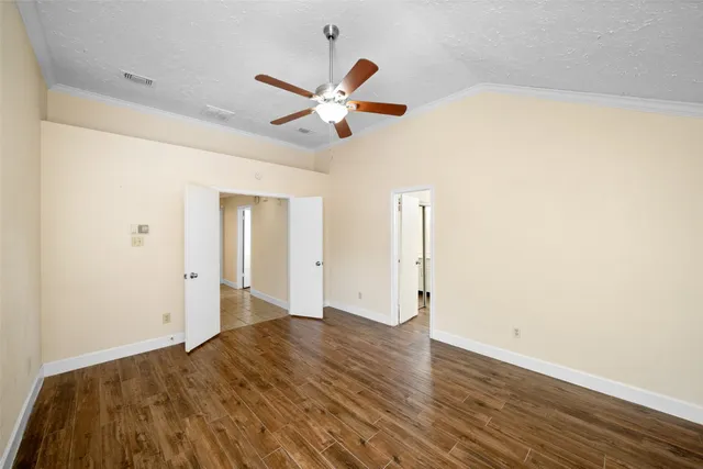a bathroom with a granite countertop toilet a sink and a mirror