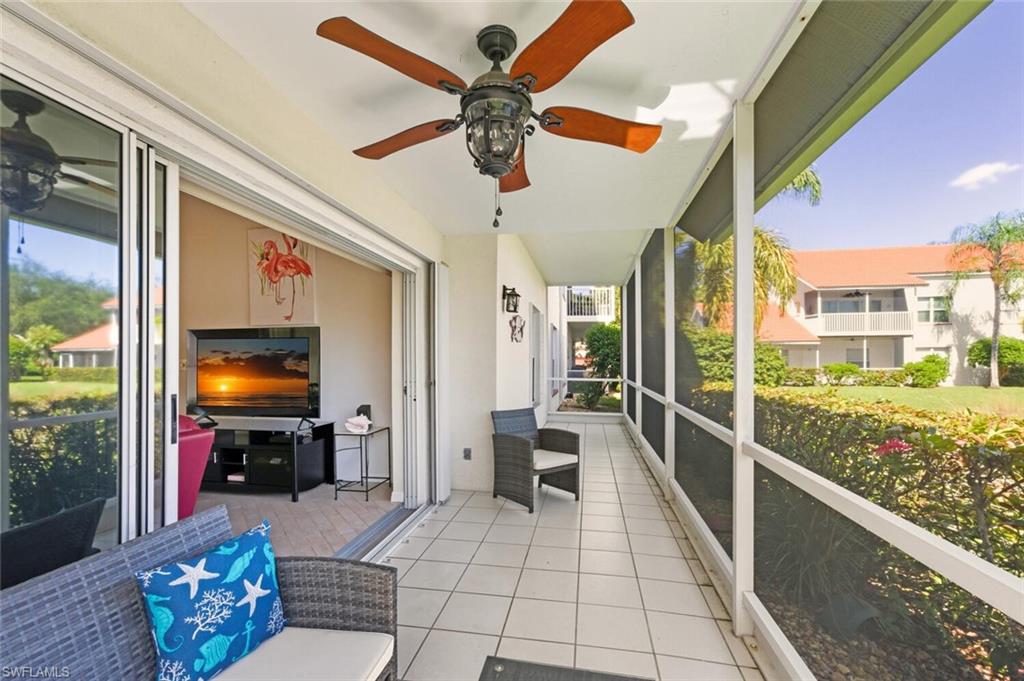 636 Windsor Square, Unit 102 Naples, FL 34104 - Photo 19 of 33 a living room with furniture and a flat screen tv