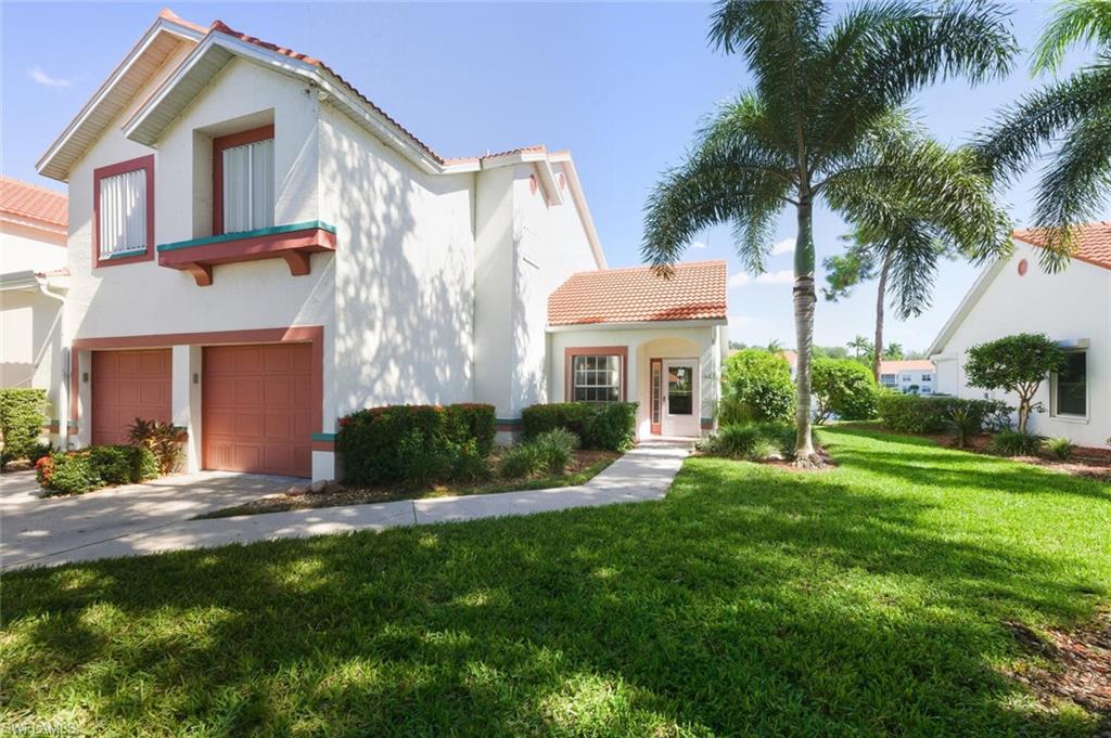 636 Windsor Square, Unit 102 Naples, FL 34104 - Photo 2 of 33 a view of a house with a yard