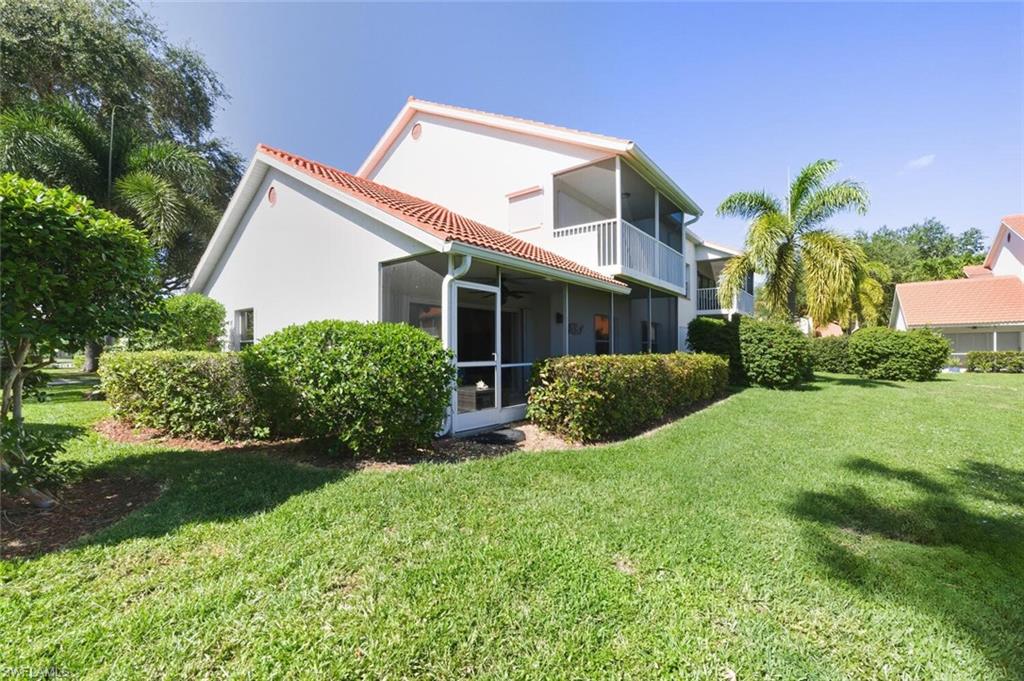 636 Windsor Square, Unit 102 Naples, FL 34104 - Photo 22 of 33 a view of a house with a yard and plants