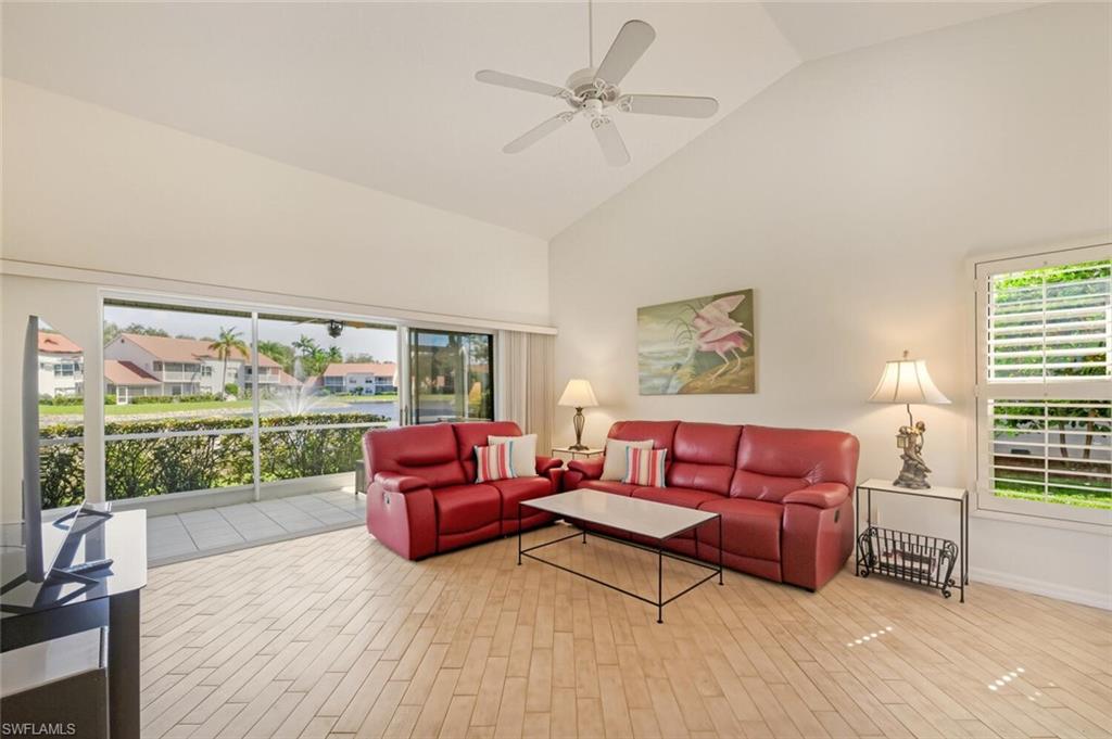 636 Windsor Square, Unit 102 Naples, FL 34104 - Photo 3 of 33 a living room with furniture fireplace and a large window