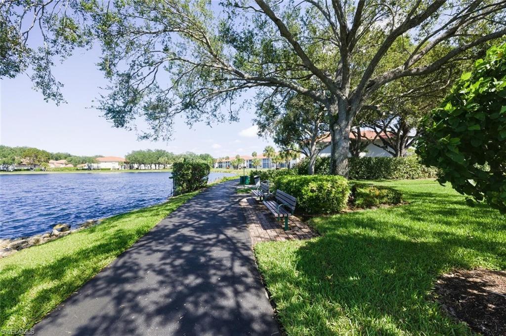 636 Windsor Square, Unit 102 Naples, FL 34104 - Photo 31 of 33 a view of a garden with a tree