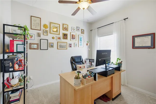 a work room with furniture and musical instruments