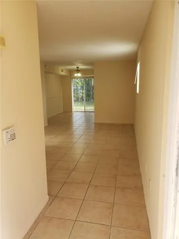 a white bath tub sitting next to a white toilet