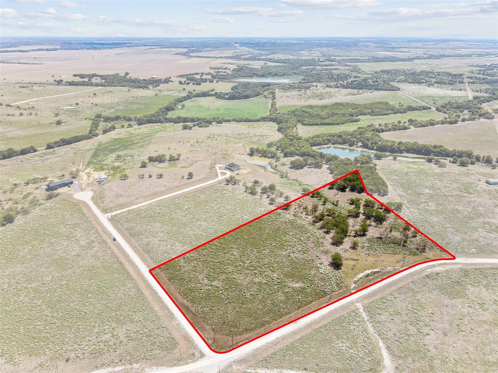 450 Private Road 453 Road, Unit LOT 12 Grandview, TX 76050 - Photo 2 of 15 Birds eye view of property featuring a water view and a rural view