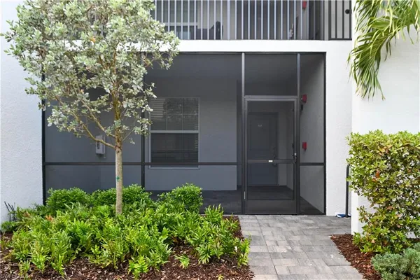 a house with a tree in front of it