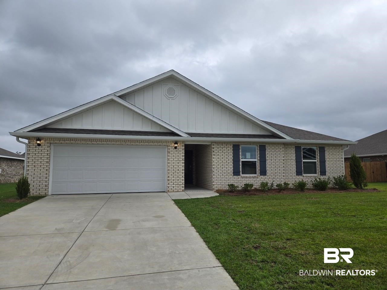 24123 Ringneck Loop Elberta, AL 36530 - Photo 1 of 7 Ranch-style house featuring a front lawn and a garage