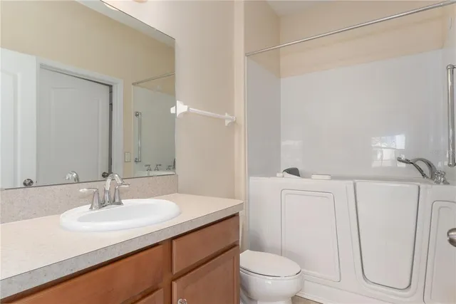 a bathroom with a sink and a vanity