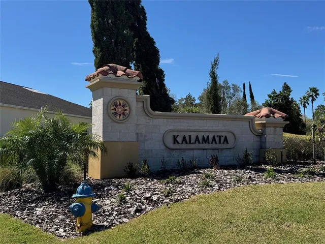 an aerial view of residential houses with outdoor space and street view