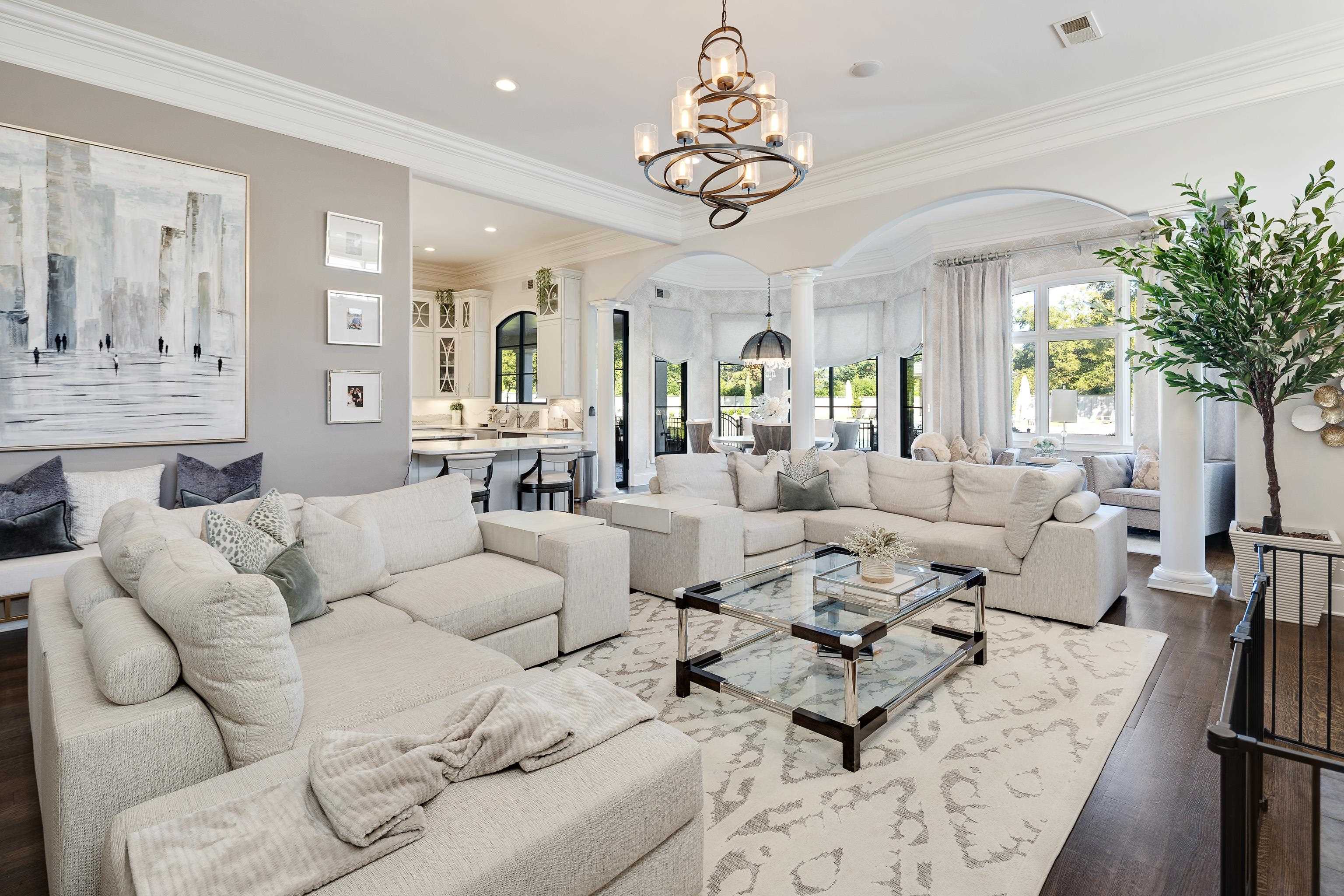 3246 Hollow Creek Road Germantown, TN 38138 - Photo 18 of 40 a living room with furniture potted plant and a chandelier