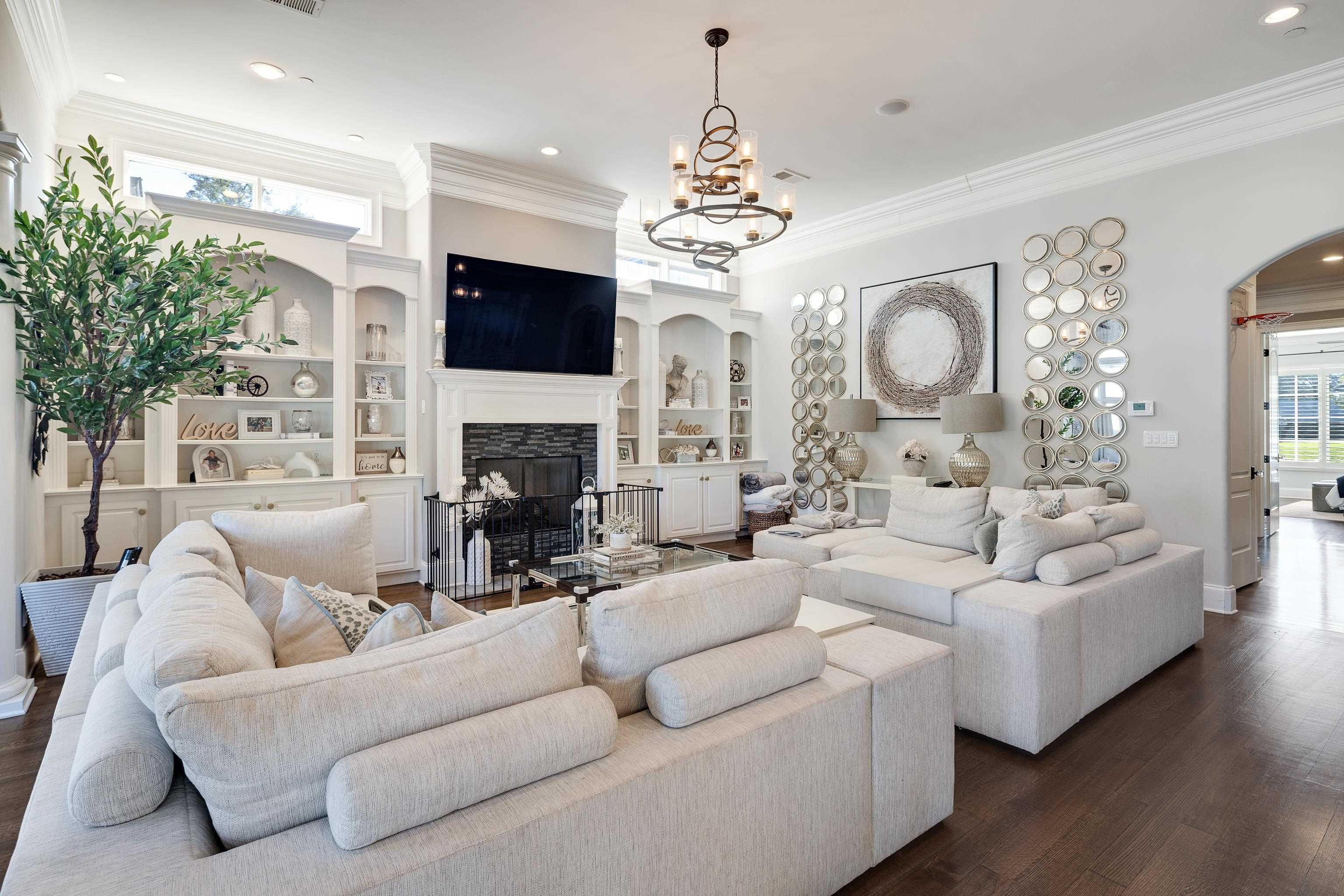 3246 Hollow Creek Road Germantown, TN 38138 - Photo 20 of 40 a living room with furniture a fireplace and a flat screen tv