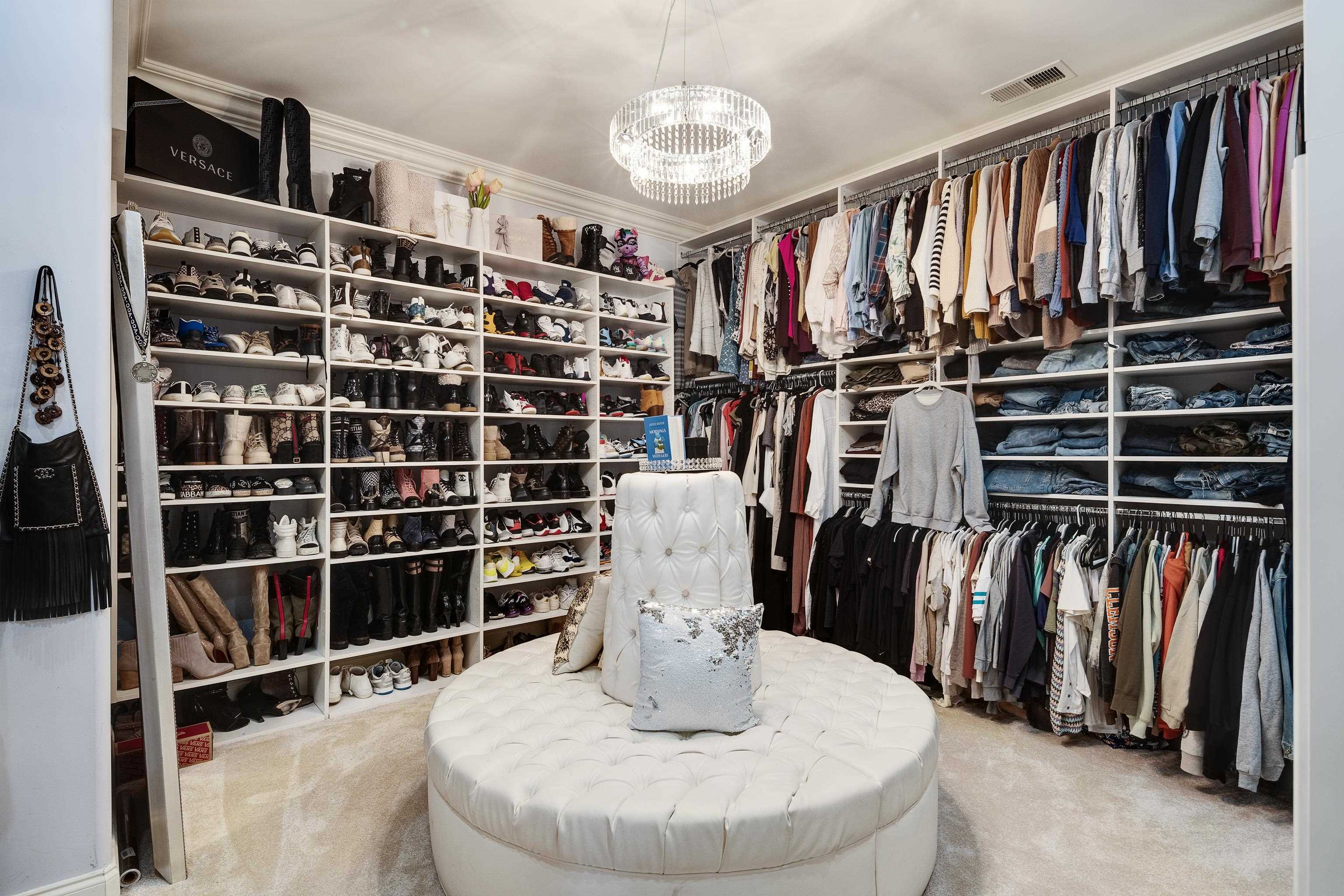 3246 Hollow Creek Road Germantown, TN 38138 - Photo 24 of 40 a view of walk in closet with clothes and shoes