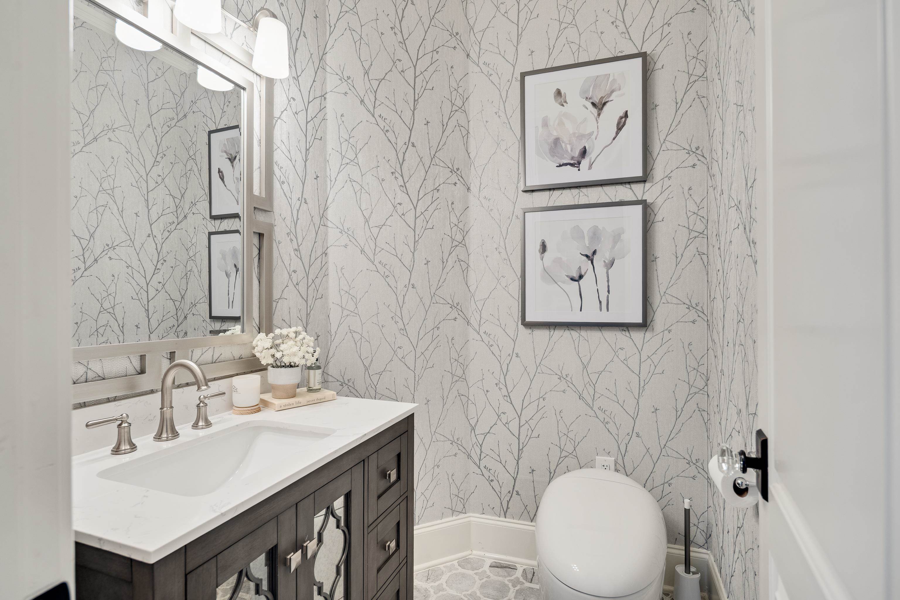 3246 Hollow Creek Road Germantown, TN 38138 - Photo 29 of 40 a bathroom with a toilet a sink and mirror