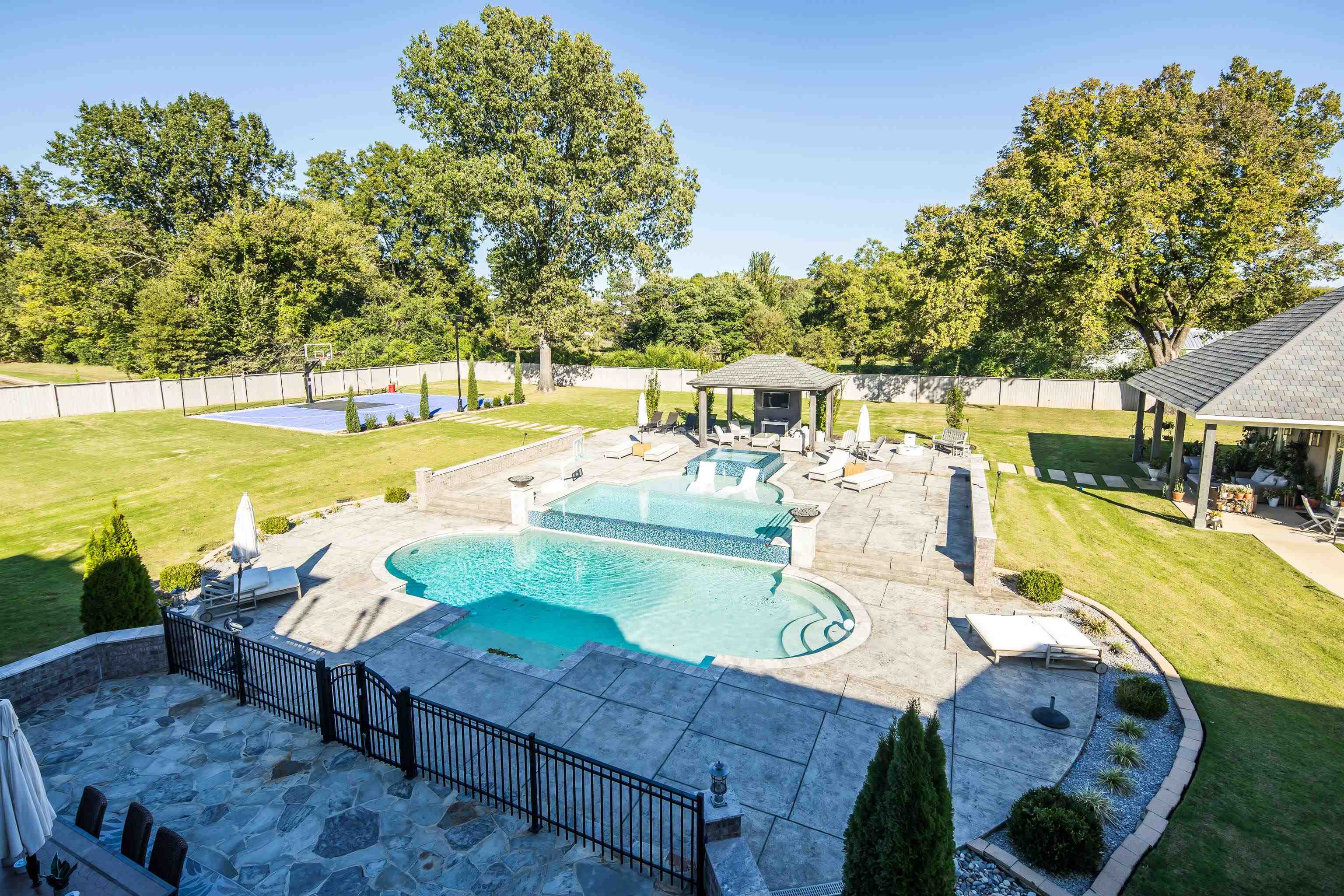 3246 Hollow Creek Road Germantown, TN 38138 - Photo 3 of 40 a view of a swimming pool with a patio