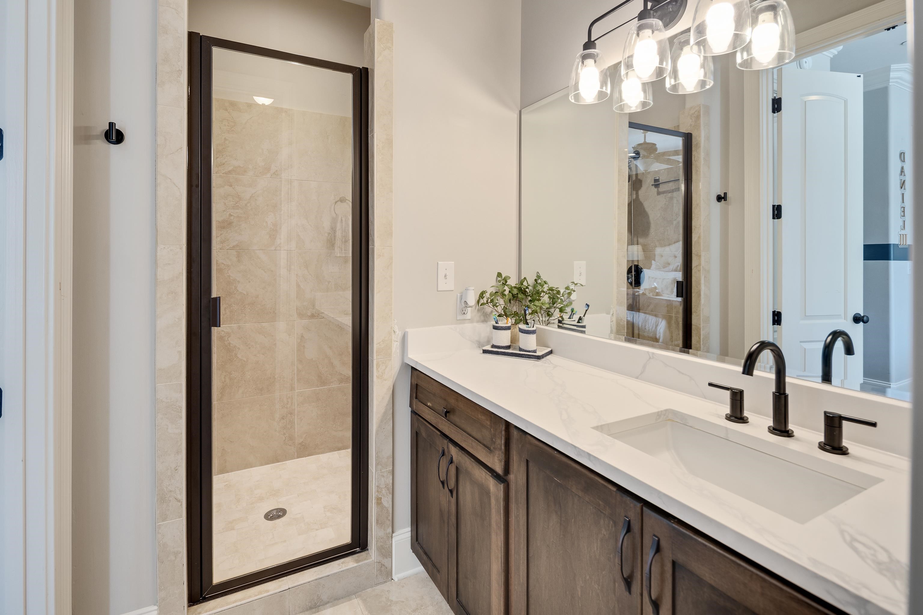 3246 Hollow Creek Road Germantown, TN 38138 - Photo 32 of 40 a bathroom with a sink and a mirror