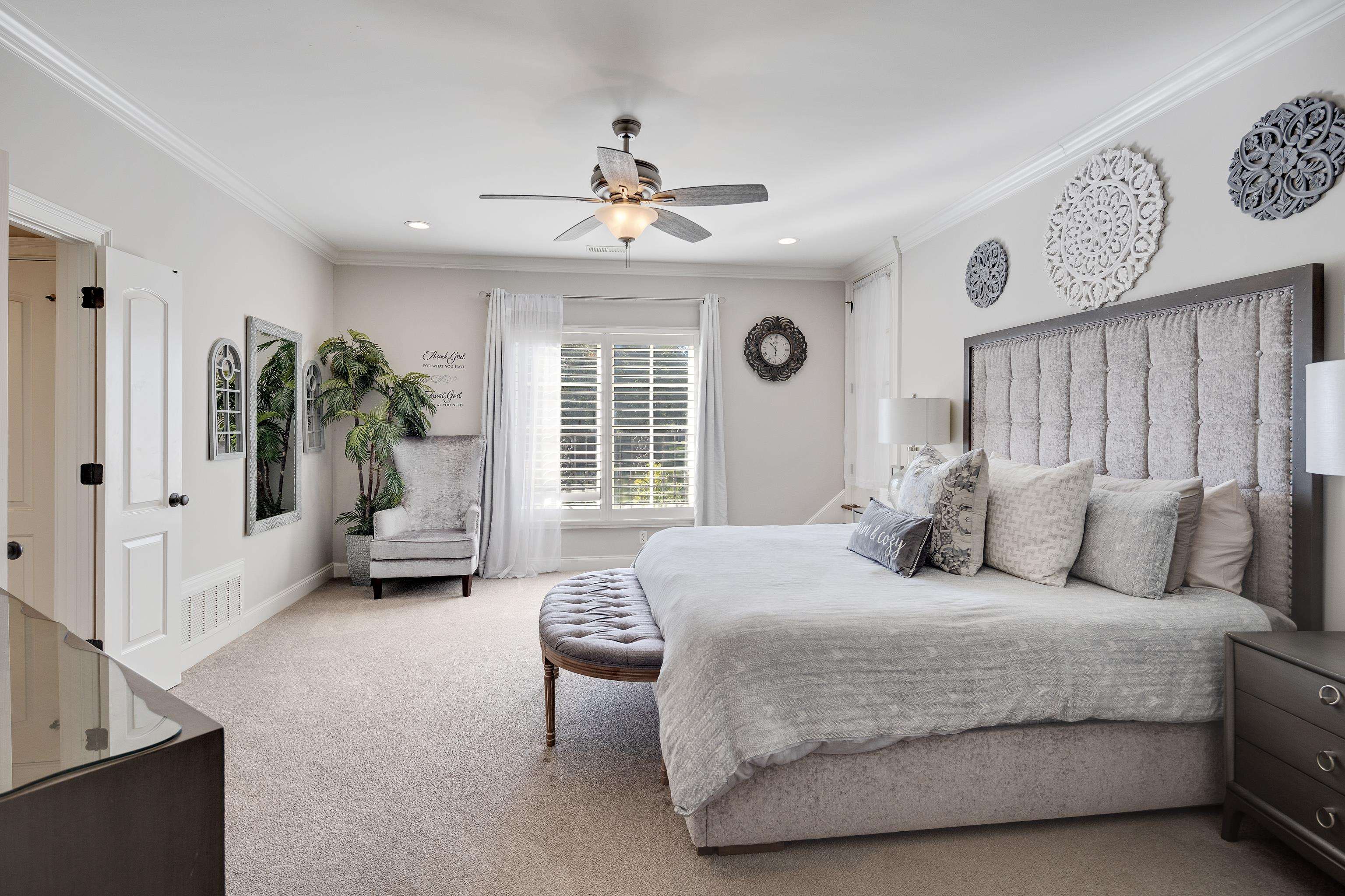 3246 Hollow Creek Road Germantown, TN 38138 - Photo 34 of 40 a bedroom with a balcony a bed and a chandelier