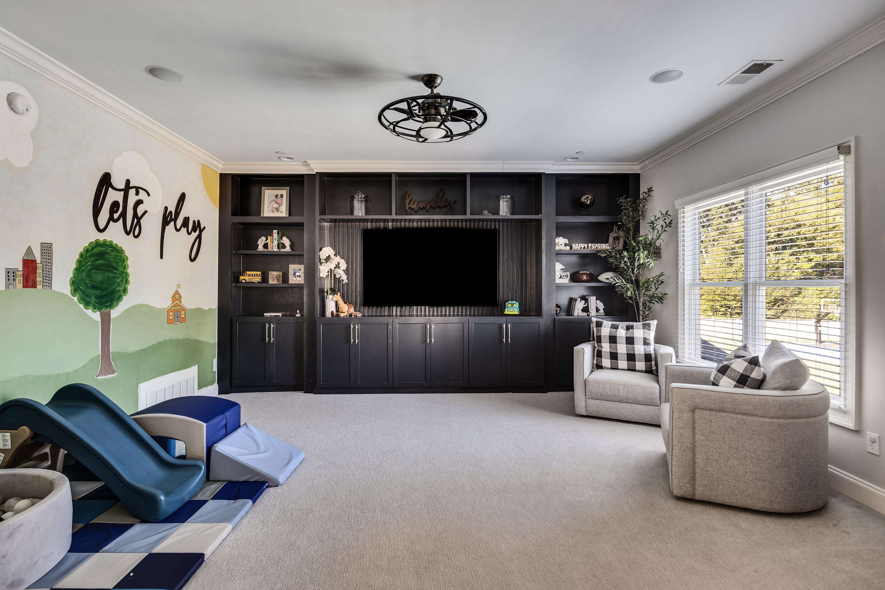 3246 Hollow Creek Road Germantown, TN 38138 - Photo 38 of 40 a living room with furniture and a flat screen tv
