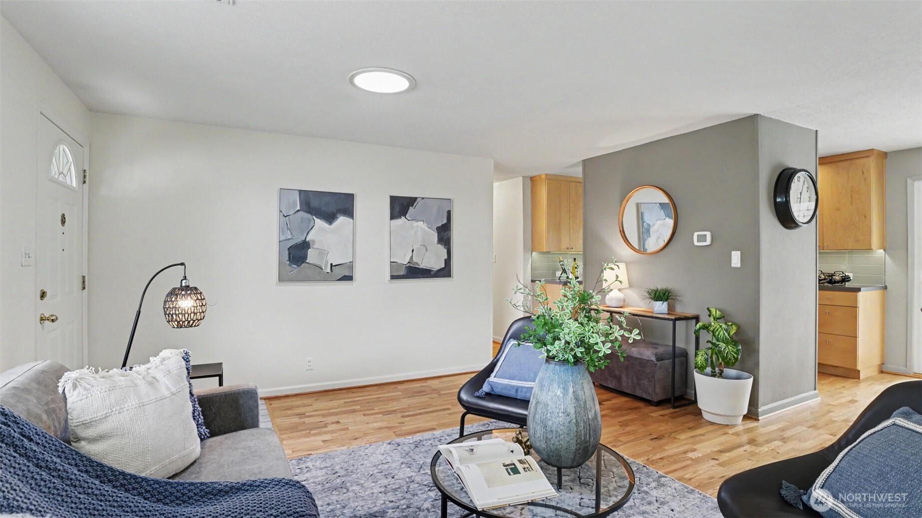 12515 Southeast 171st Street Renton, WA 98058 - Photo 7 of 24 a living room with furniture flowerpot and wooden floor