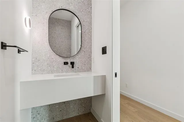 a bathroom with a sink and a mirror
