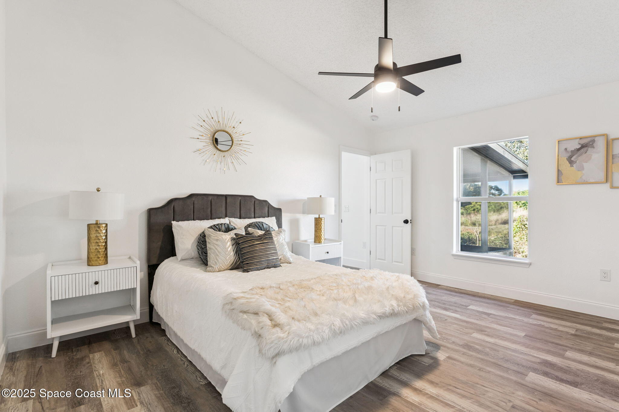 6200 Edison Street Cocoa, FL 32927 - Photo 13 of 21 a bedroom with a bed and a window