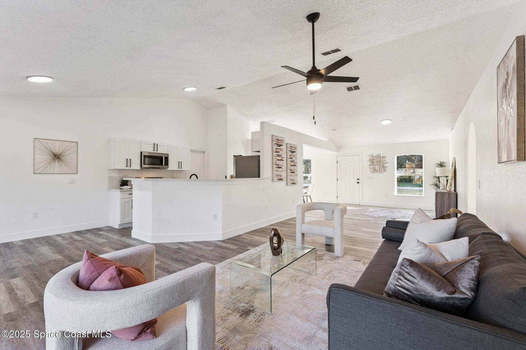 6200 Edison Street Cocoa, FL 32927 - Photo 5 of 21 a living room with furniture and kitchen view