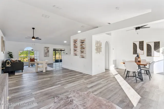 a living room with furniture and a table