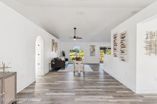 a view of a living room and dining room