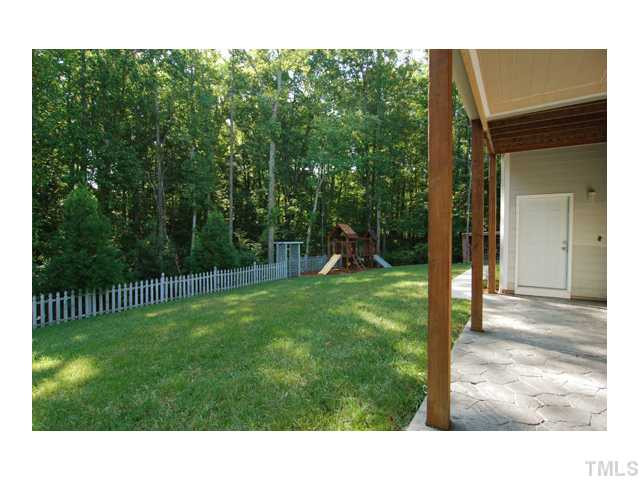 6911 Wexford Woods Trail Raleigh, NC 27613 - Photo 11 of 12 View of flat backyard....private and wooded. Stamped concrete patio.