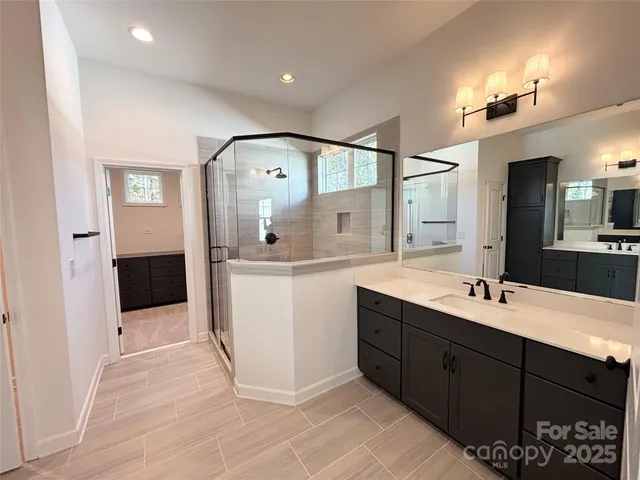 a bathroom with a bathtub and shower