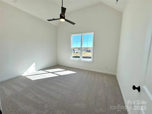 a view of yard with swimming pool and green space