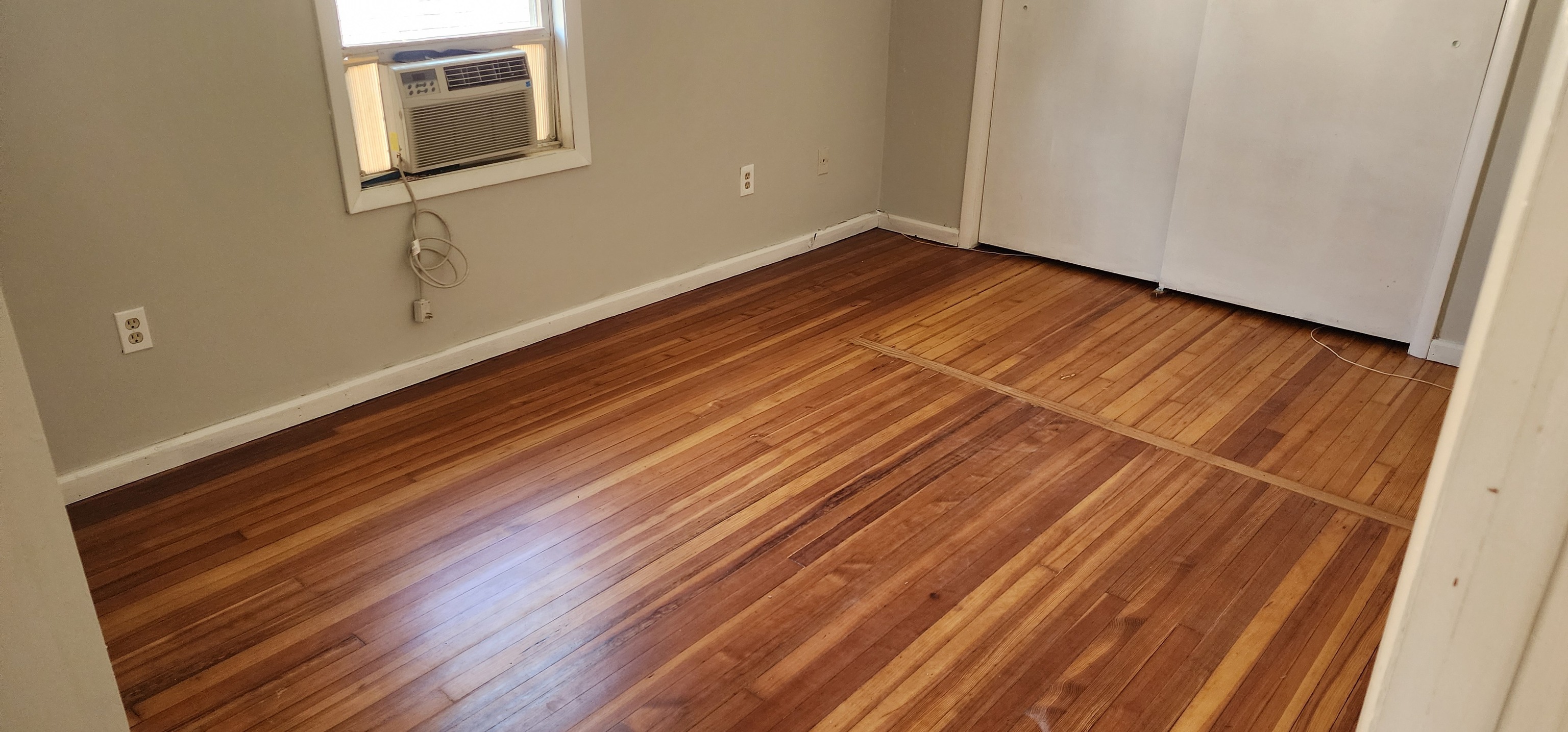 539 Garfield Avenue Bridgeport, CT 06606 - Photo 7 of 7 a view of a room with wooden floor and a window