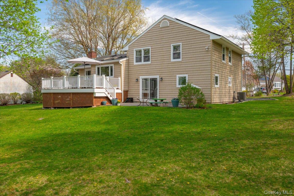 8 Fairlawn Parkway Rye Brook, NY 10573 - Photo 2 of 25 The Back of the house with a Composite Deck and a patio