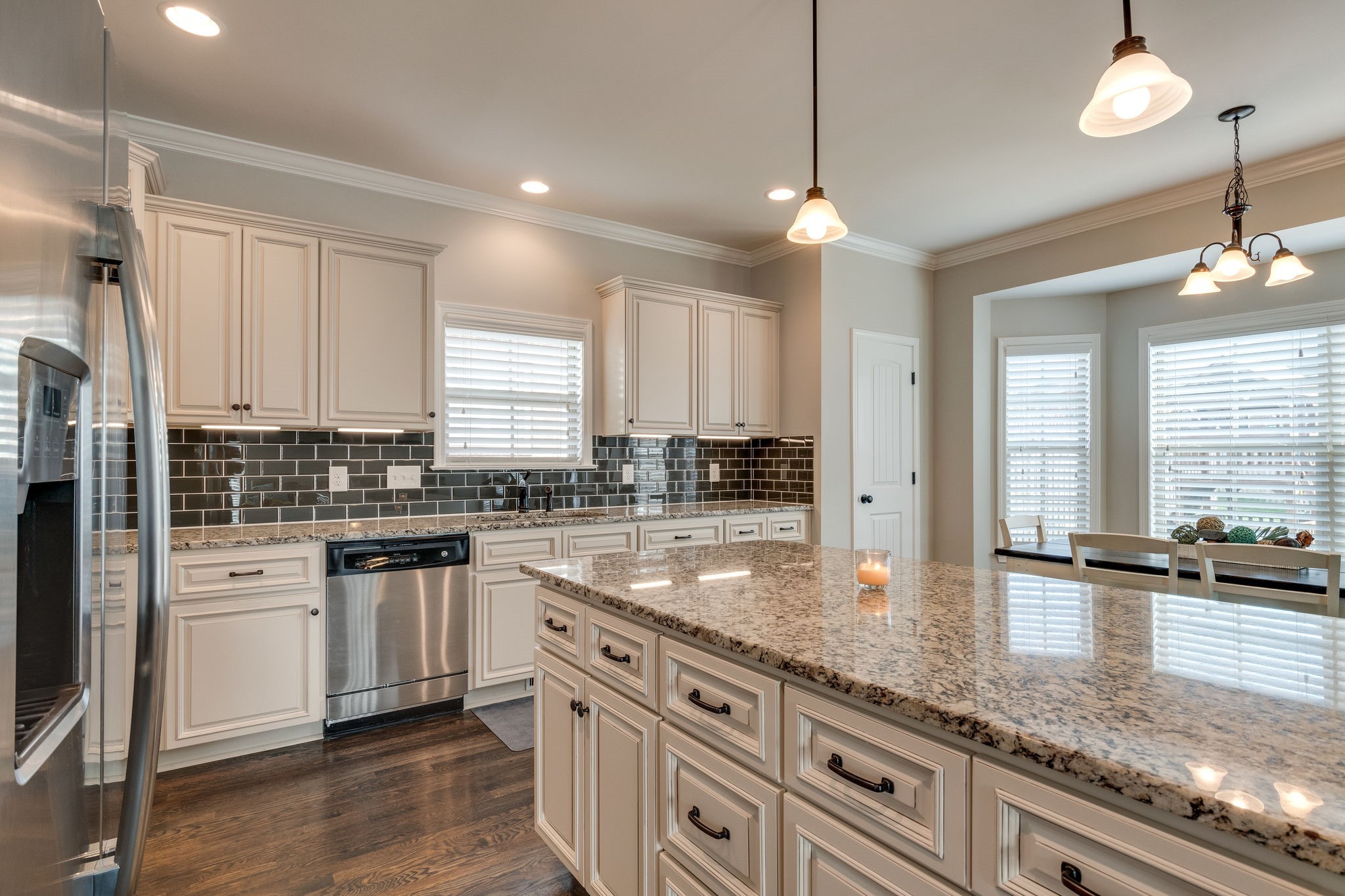 a kitchen with stainless steel appliances granite countertop a sink a stove and a granite counter tops