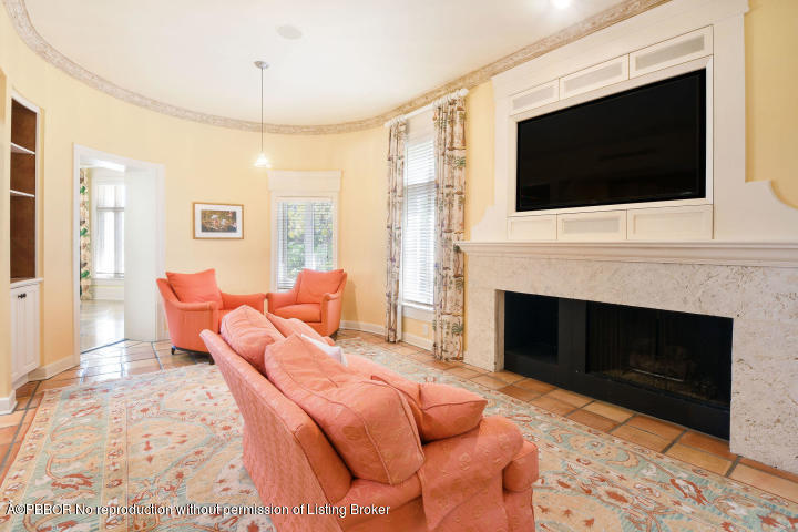 515 South Beach Road Hobe Sound, FL 33455 - Photo 11 of 30 a living room with furniture a fireplace and a flat screen tv