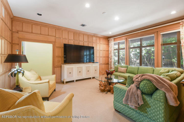 515 South Beach Road Hobe Sound, FL 33455 - Photo 12 of 30 a living room with furniture and a flat screen tv