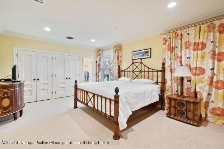 515 South Beach Road Hobe Sound, FL 33455 - Photo 17 of 30 a white bed sitting in a room next to a window