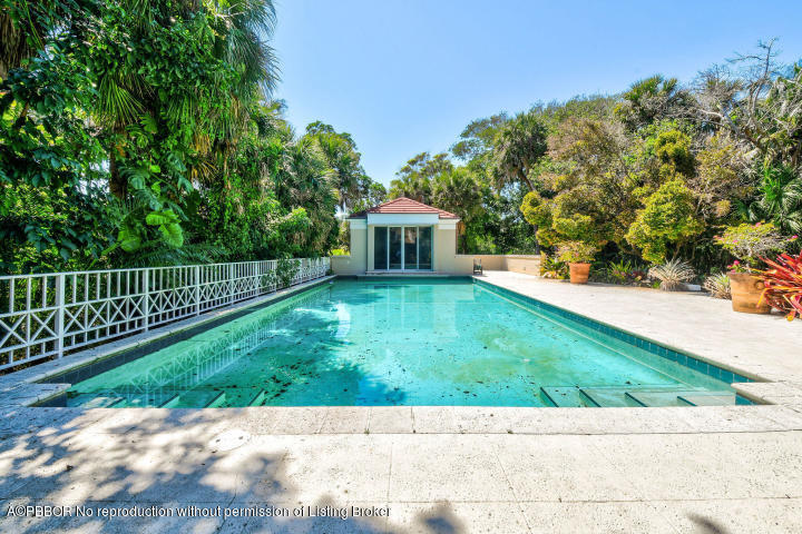 515 South Beach Road Hobe Sound, FL 33455 - Photo 22 of 30 a view of a house with a yard