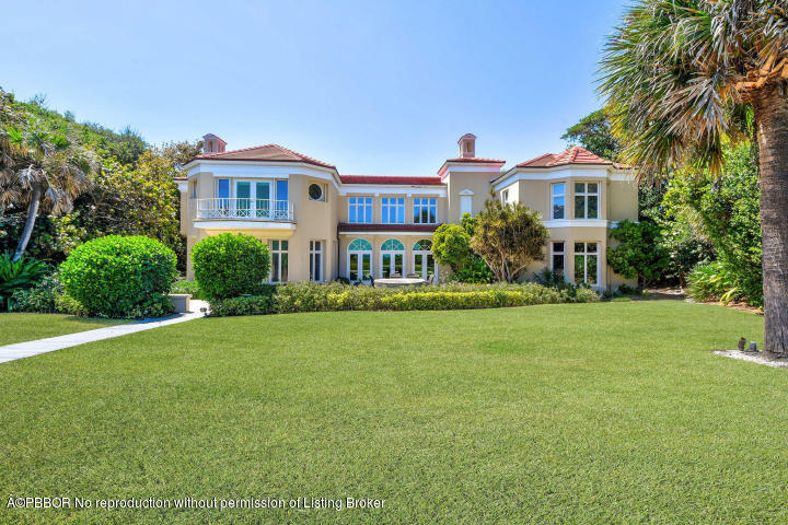 515 South Beach Road Hobe Sound, FL 33455 - Photo 27 of 30 a front view of a house with a garden