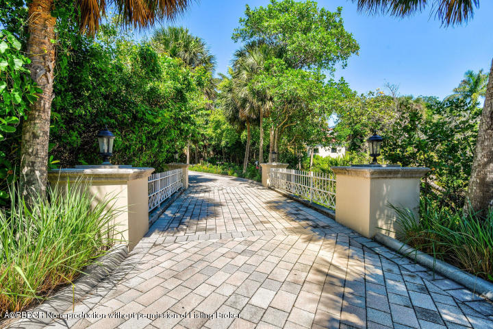 515 South Beach Road Hobe Sound, FL 33455 - Photo 5 of 30 a view of a pathway with a wrought fence