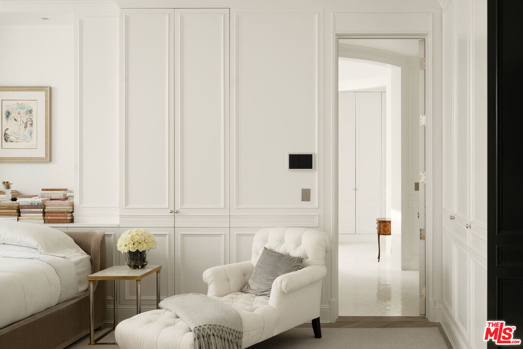 227 North Tigertail Road Los Angeles, CA 90049 - Photo 18 of 42 a bedroom with furniture and a potted plant