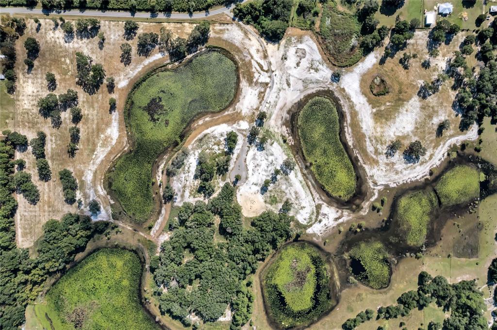 180 Southeast Street Road Umatilla, FL 32784 - Photo 14 of 14 an aerial view of a swimming pool