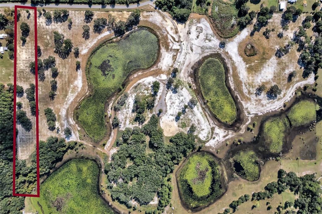 180 Southeast Street Road Umatilla, FL 32784 - Photo 2 of 14 an aerial view of a swimming pool