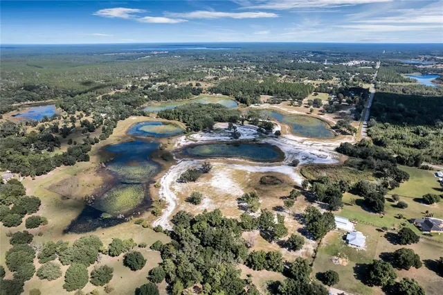 an aerial view of residential house and lake view