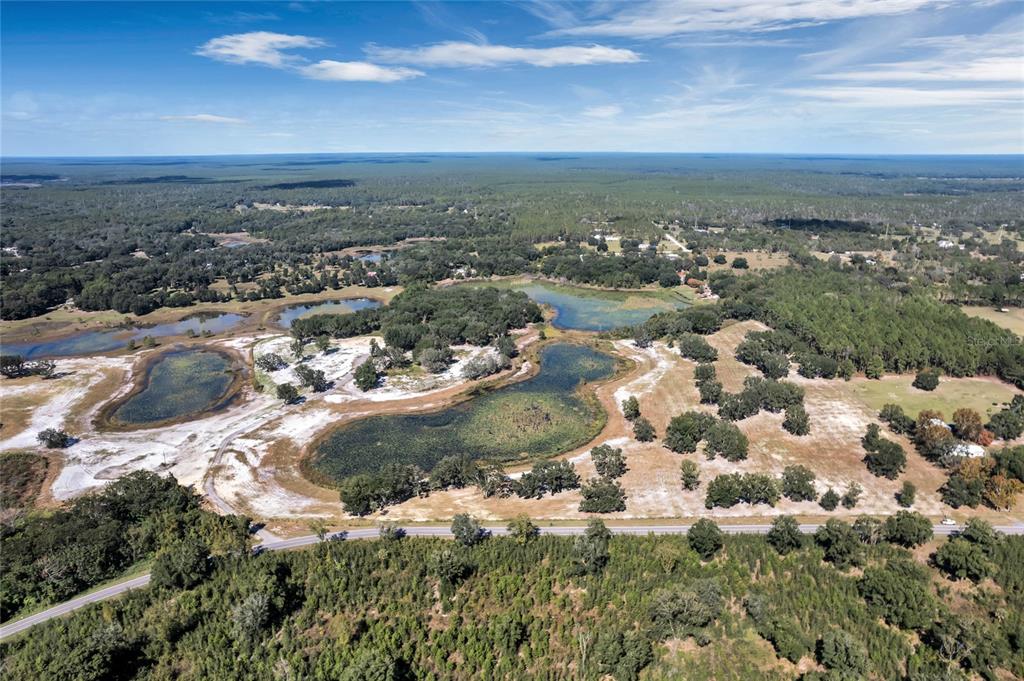 180 Southeast Street Road Umatilla, FL 32784 - Photo 8 of 14 an aerial view of lot of trees