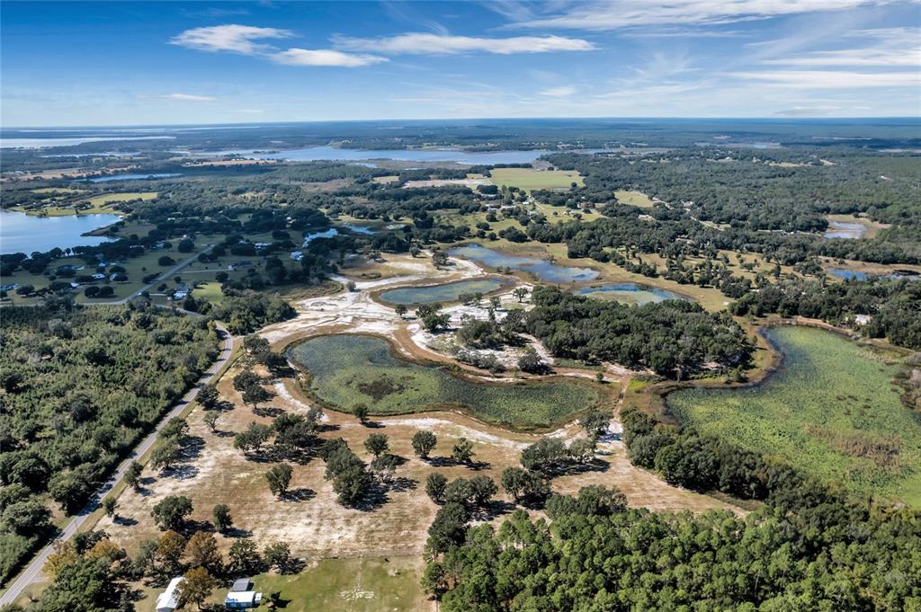 180 Southeast Street Road Umatilla, FL 32784 - Photo 9 of 14 an aerial view of residential house and lake view