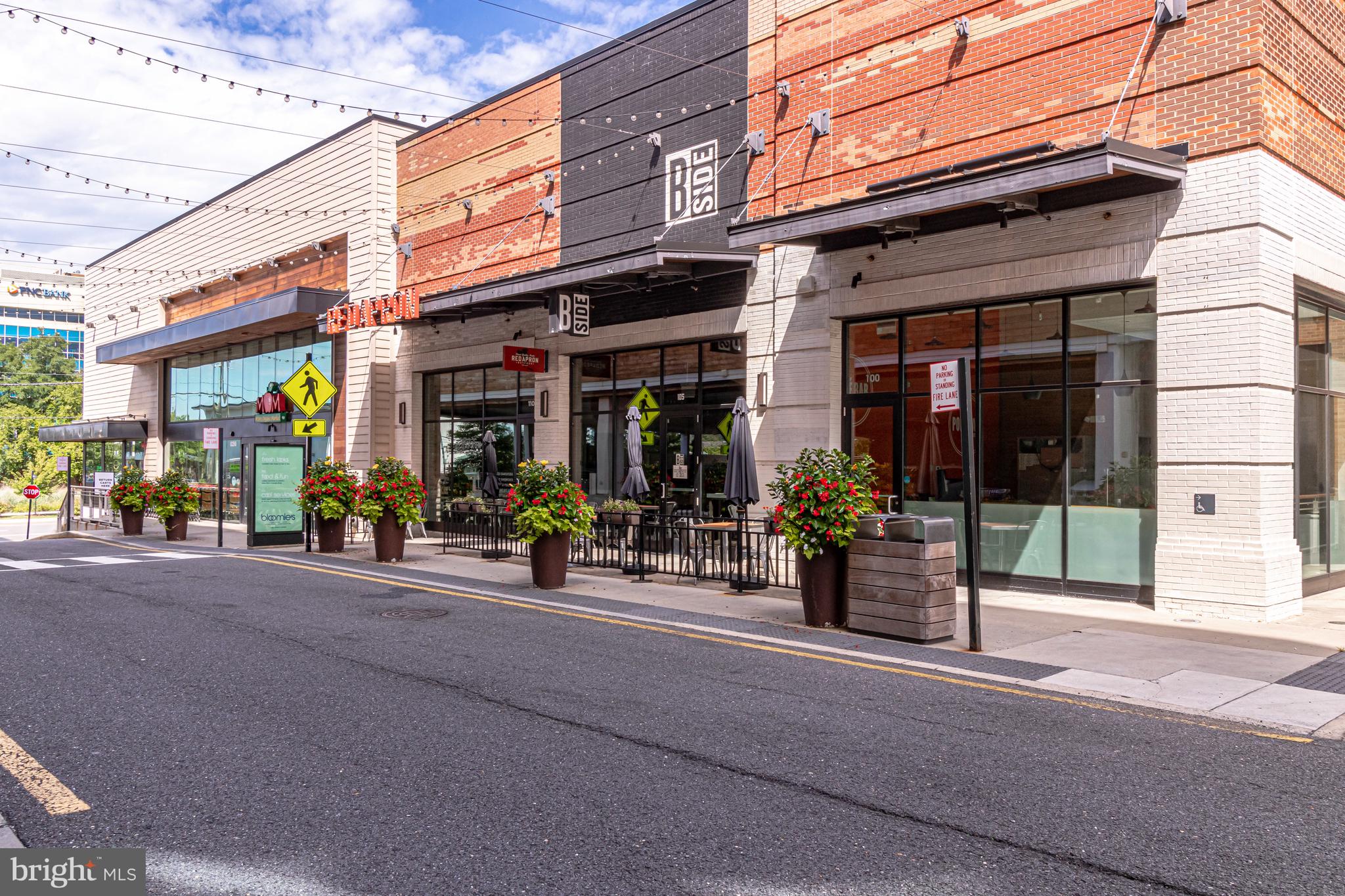 2726 Gallows Road, Unit 712 Vienna, VA 22180 - Photo 50 of 55 a view of a street with shops
