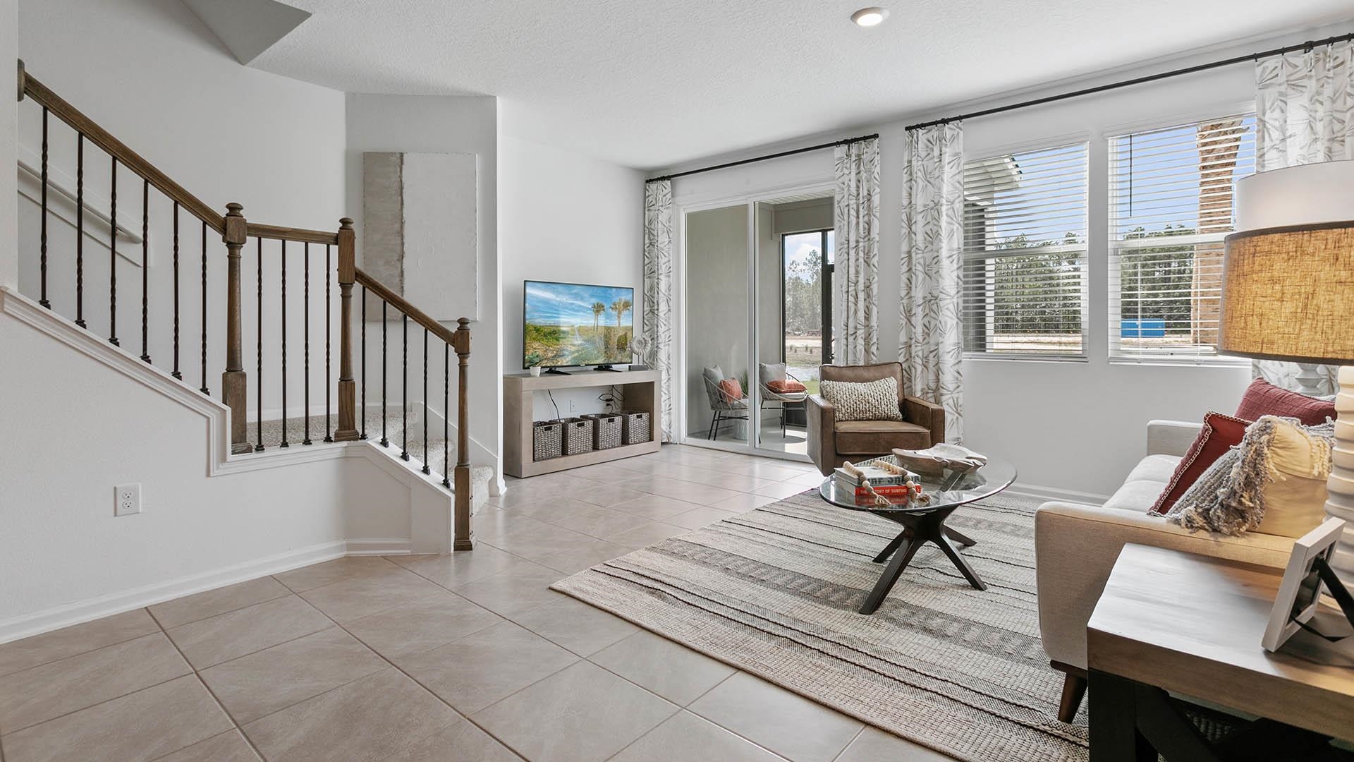 177 Redbud Road Palm Coast, FL 32137 - Photo 12 of 33 a living room with furniture and a window