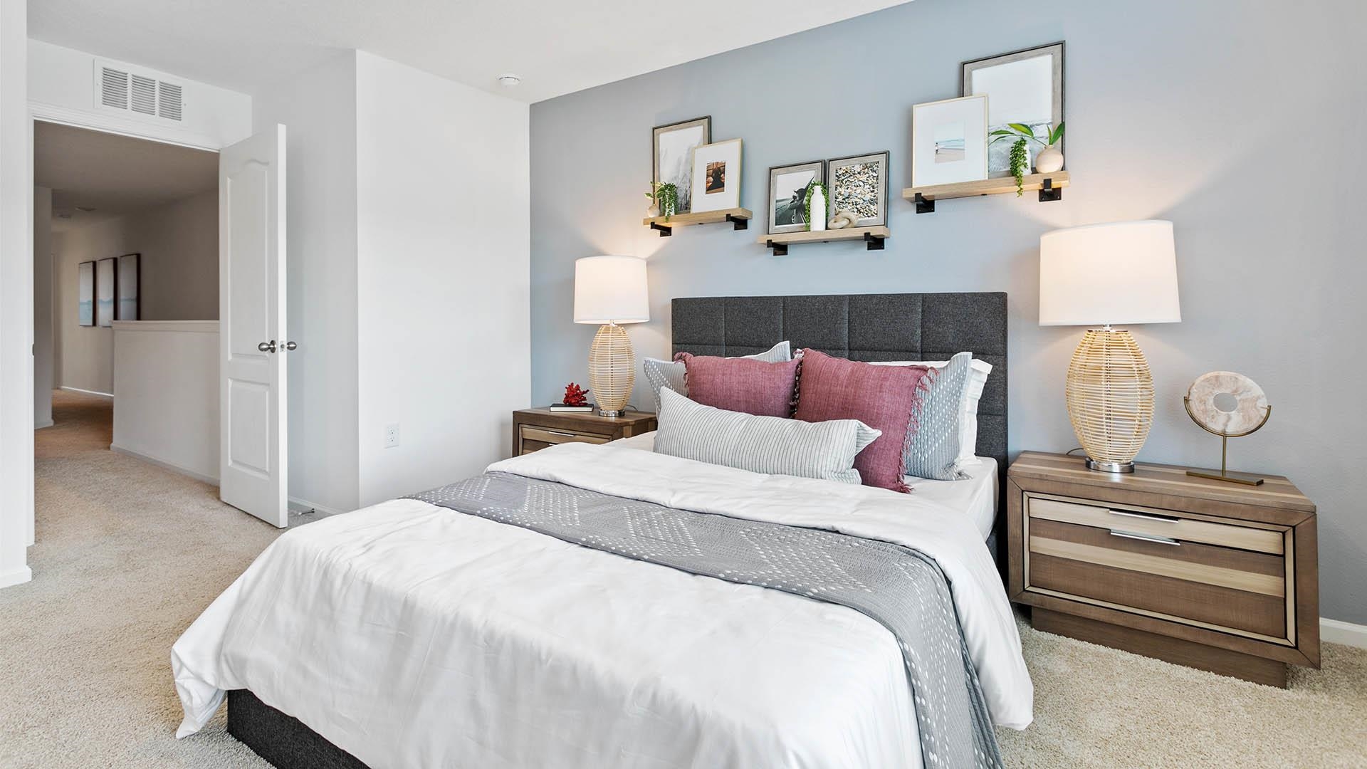 177 Redbud Road Palm Coast, FL 32137 - Photo 13 of 33 a bedroom with bed and a night stand