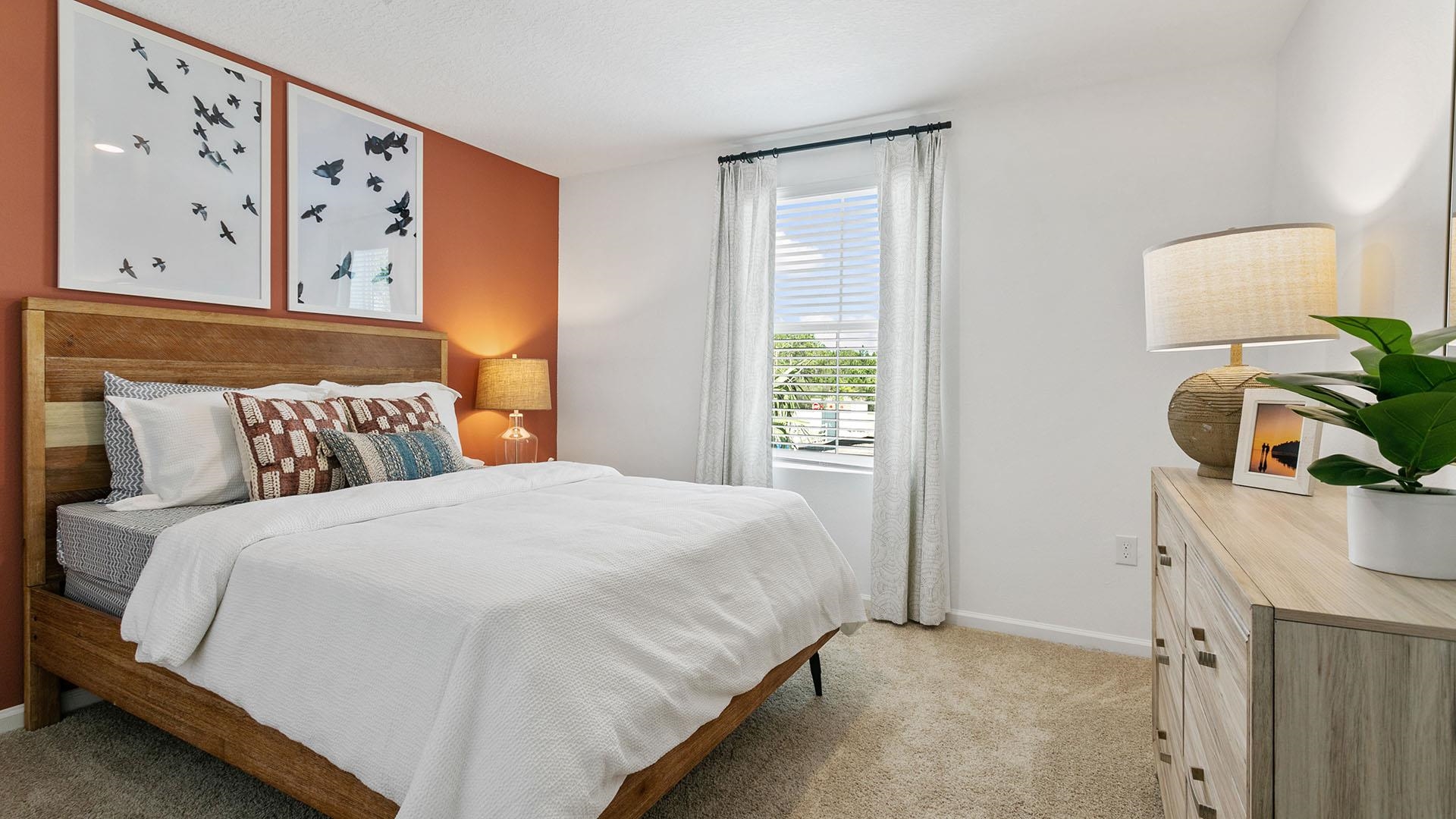 177 Redbud Road Palm Coast, FL 32137 - Photo 19 of 33 a bedroom with a bed and a window